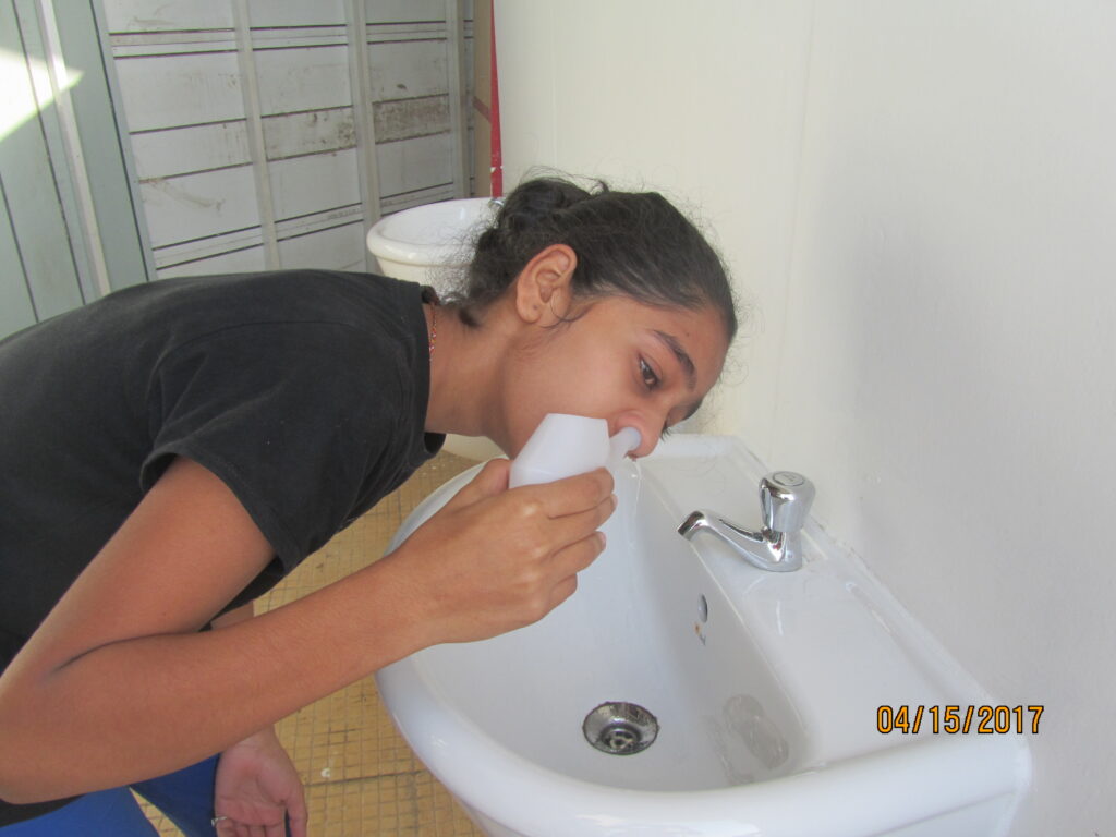 Jala Neti Kriya performed for nasal cleansing under guided yoga practice.